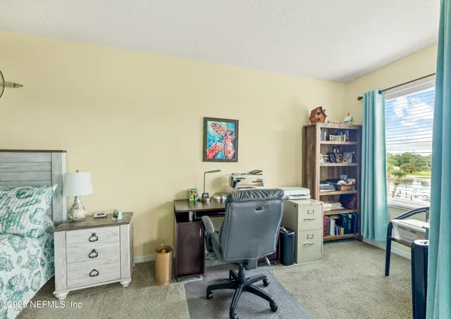 a bed room with a bed and a dresser