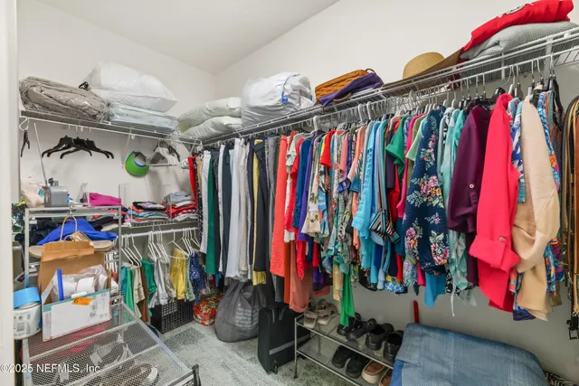 a bedroom with a bed and a view of bathroom