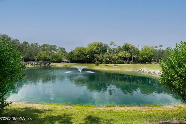 a view of a lake with green space