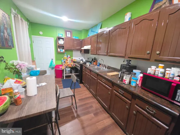 a kitchen with a table chairs and a stove