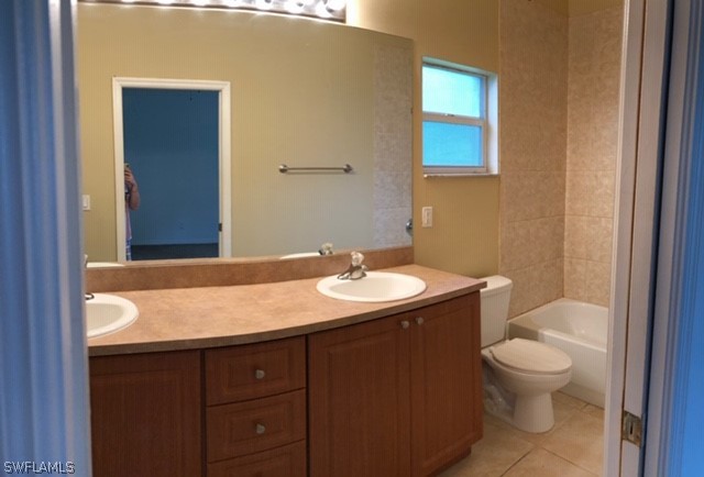18327 Heather Road Fort Myers, FL 33967 - Photo 14 of 15 a bathroom with a sink a toilet and mirror