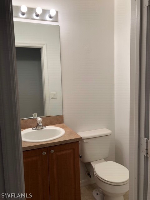 18327 Heather Road Fort Myers, FL 33967 - Photo 9 of 15 a bathroom with a sink a toilet and mirror