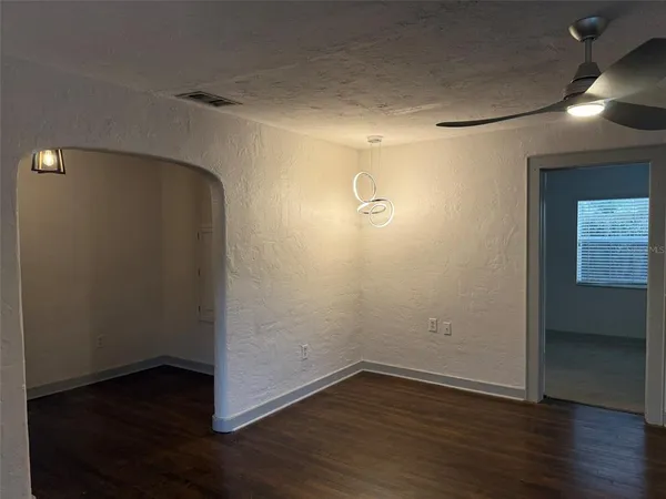 a kitchen with stainless steel appliances granite countertop a refrigerator a sink dishwasher a stove with wooden cabinets