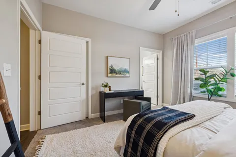 a bedroom with a bed and a dresser