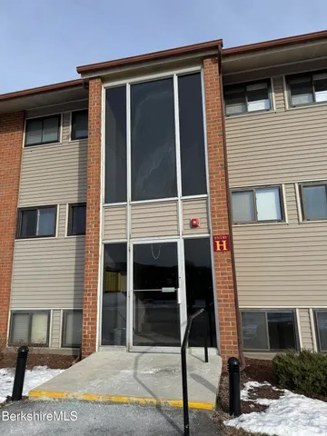 a front view of a house with garage