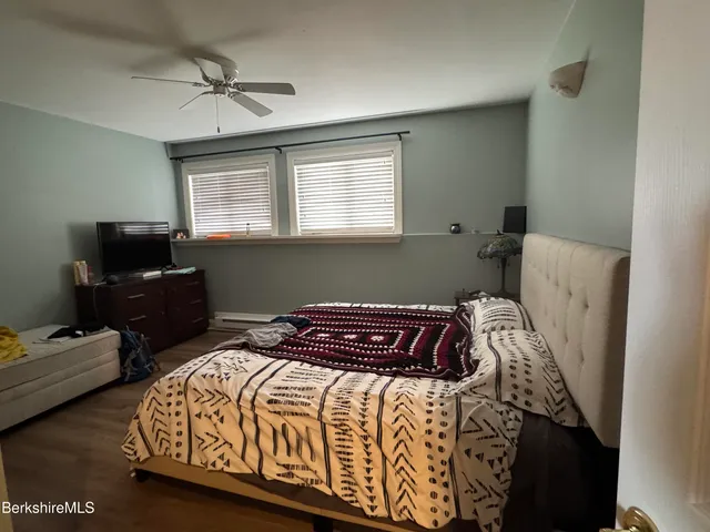 a bedroom with a bed and furniture