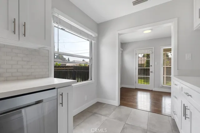 a view of a kitchen cabinets a sink and dishwasher in a kitchen