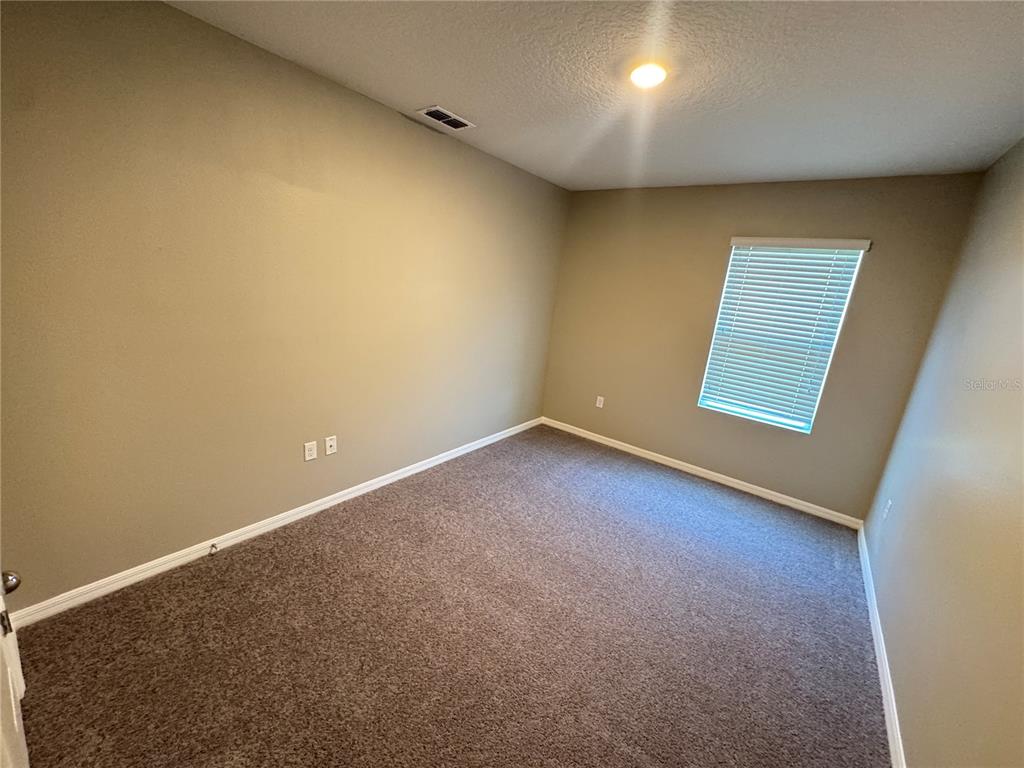 2323 Silverview Drive Lakeland, FL 33811 - Photo 13 of 33 an empty room with a empty space and window