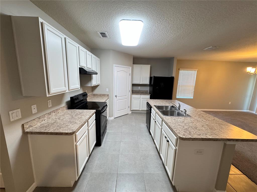 2323 Silverview Drive Lakeland, FL 33811 - Photo 20 of 33 a kitchen with a sink stove and refrigerator
