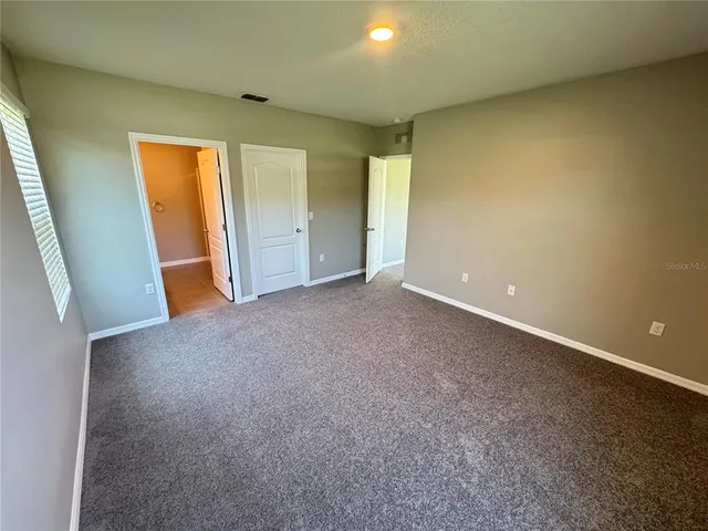 a bathroom with a shower and toilet
