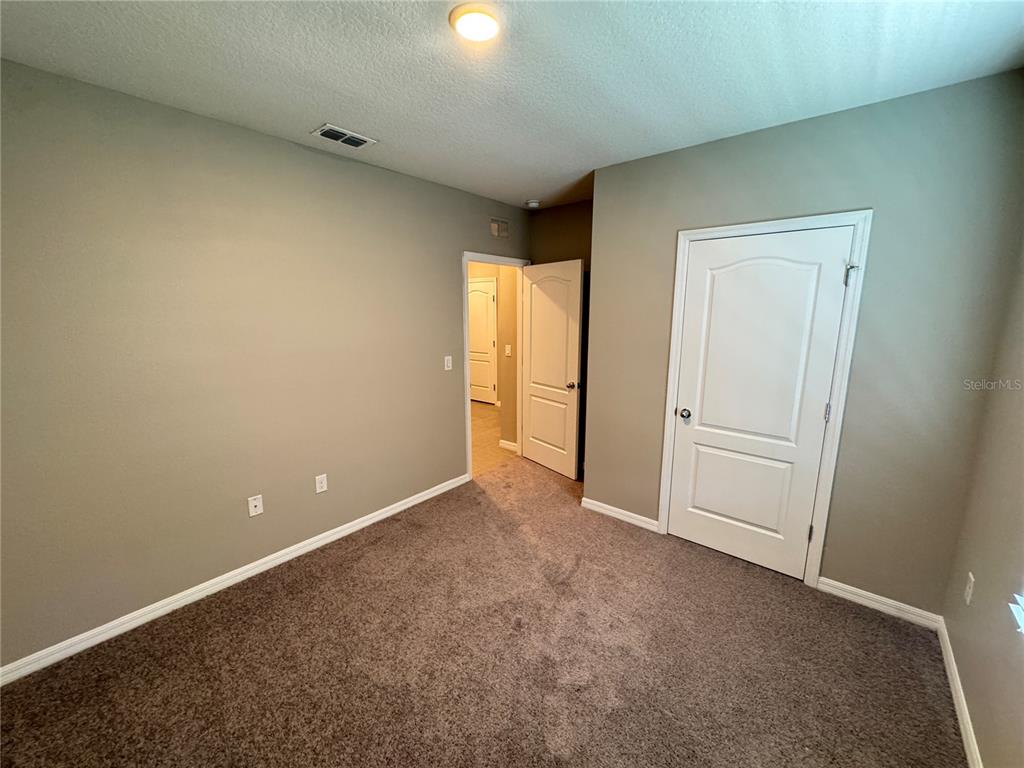 2323 Silverview Drive Lakeland, FL 33811 - Photo 8 of 33 an empty room with windows and closet
