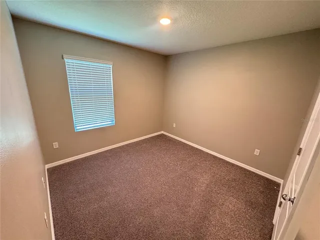an empty room with closet area