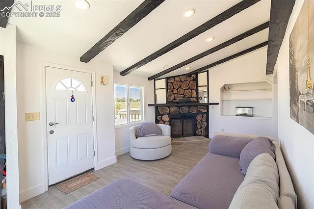 a living room with furniture and a large window