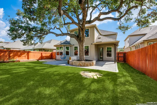 a view of a house with a yard porch and sitting area