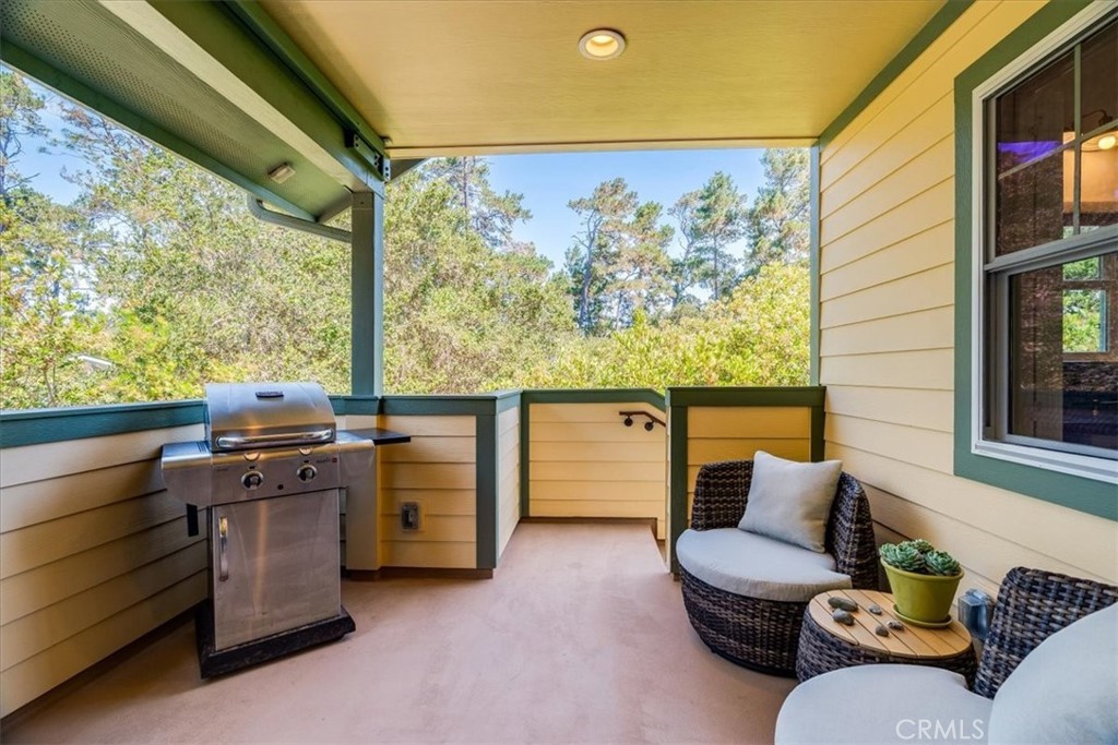 1560 Emerson Road Cambria, CA 93428 - Photo 2 of 13 At top of the stairs a lovely patio to enjoy, furnished with a propane BBQ.