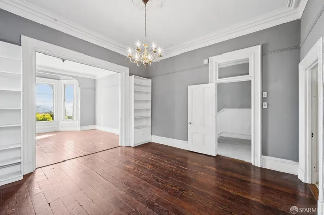 a bathroom with a sink and mirror with shower