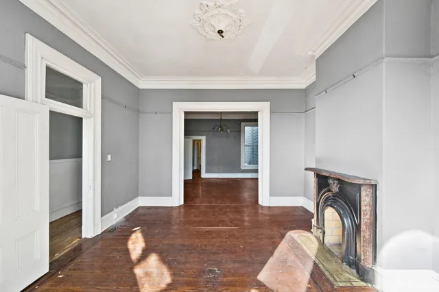a view of livingroom with hardwood floor and hallway