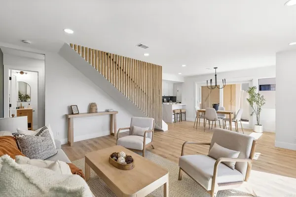 a living room with furniture and a table