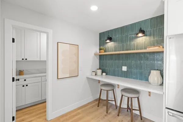 a workspace with furniture and wooden floor