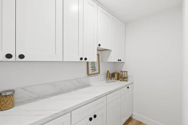 a kitchen with a sink and cabinets