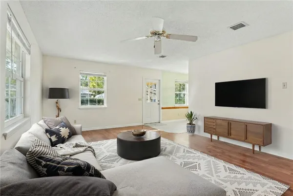 a living room with furniture and a flat screen tv