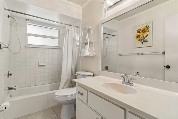 a bathroom with a sink a toilet and bathtub