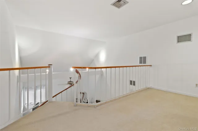 a bedroom with a bed and a ceiling fan