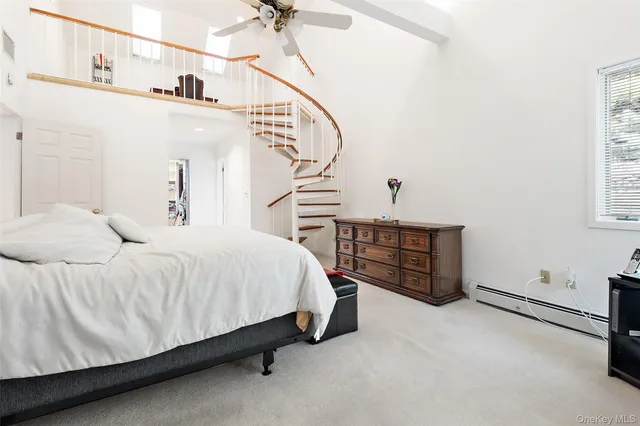 a bathroom with a sink mirror vanity and toilet