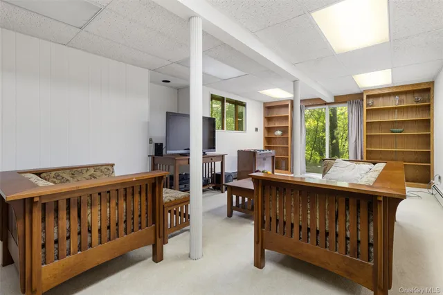 a bedroom with furniture and a window