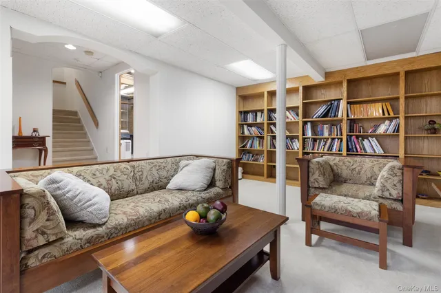 a room with furniture and a ceiling fan