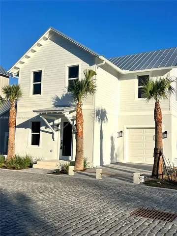 a plant in front of a house