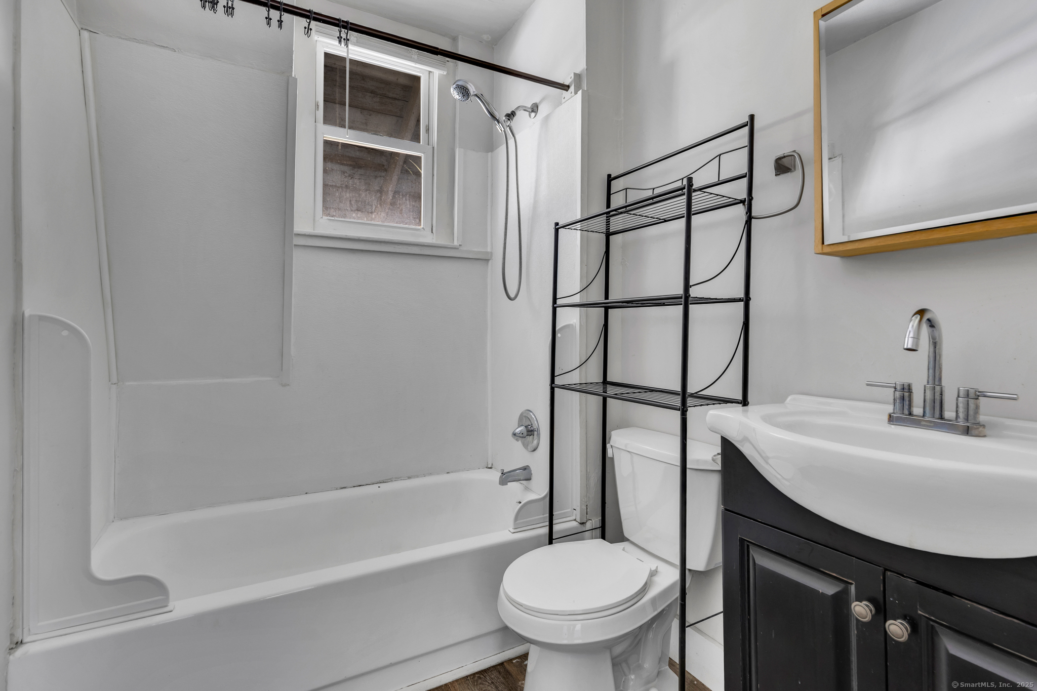 82 Water Street, Unit 6 Torrington, CT 06790 - Photo 9 of 14 a bathroom with a sink toilet and shower