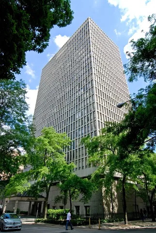 a front view of a building with garden