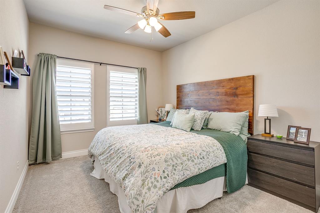 5709 Pope Creek Road Fort Worth, TX 76126 - Photo 31 of 39 The first of two spacious upstairs bedrooms — bright and airy with large windows and beautiful plantation shutters!