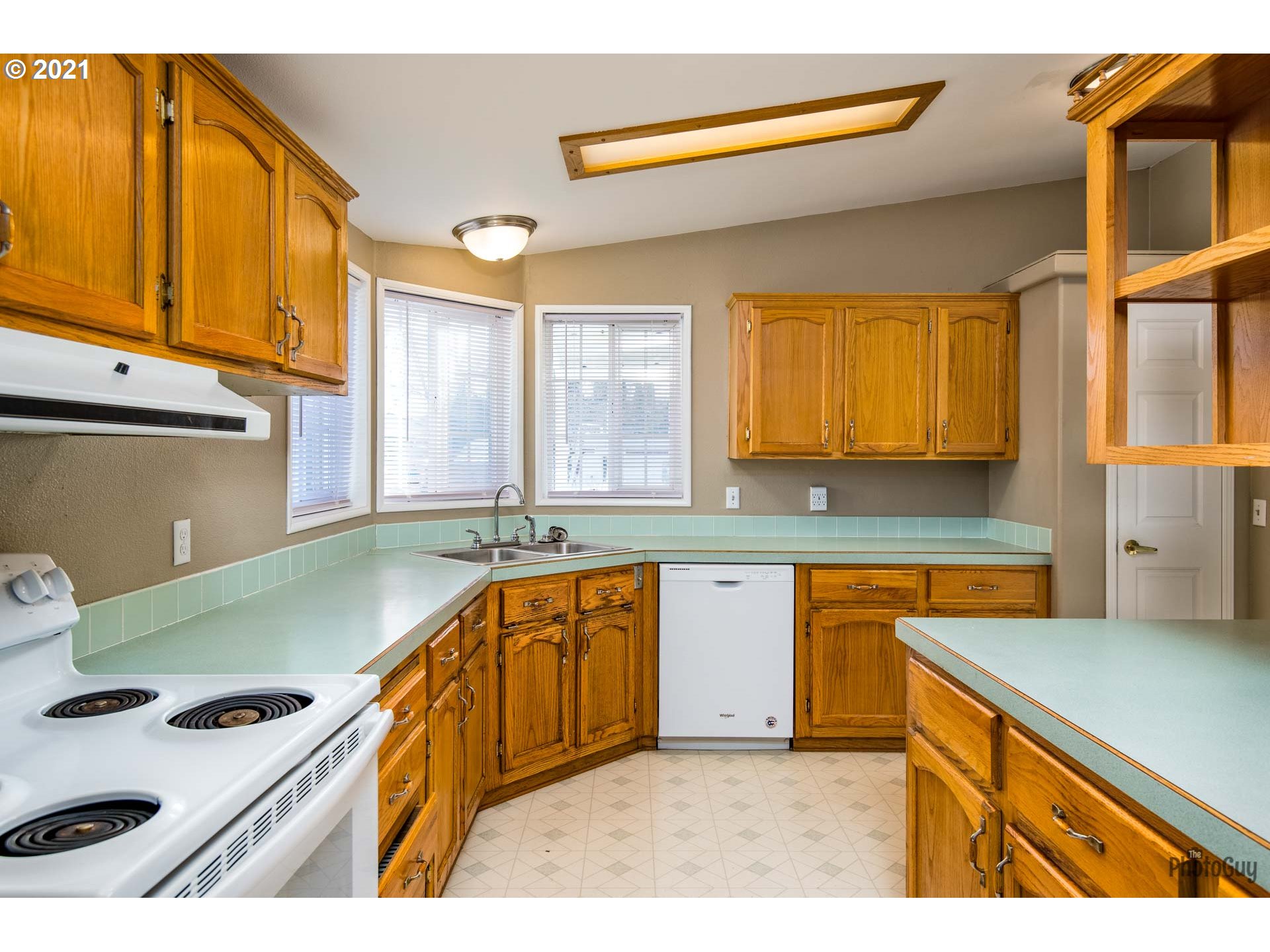 2012 Scott Road Springfield, OR 97477 - Photo 8 of 32 a kitchen with a sink a stove and cabinets