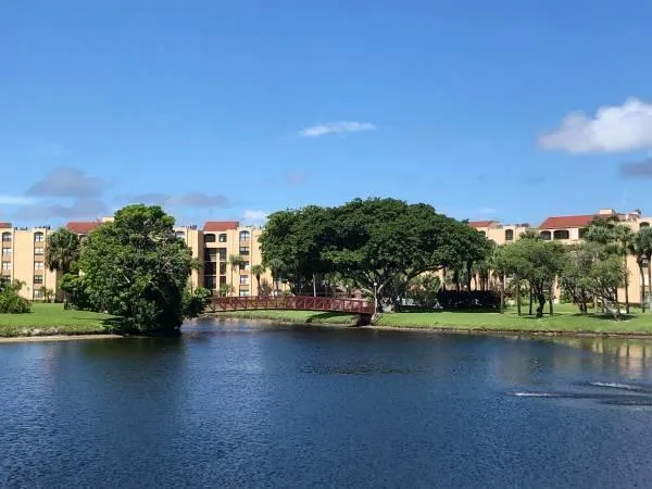 a view of a lake with houses in the background