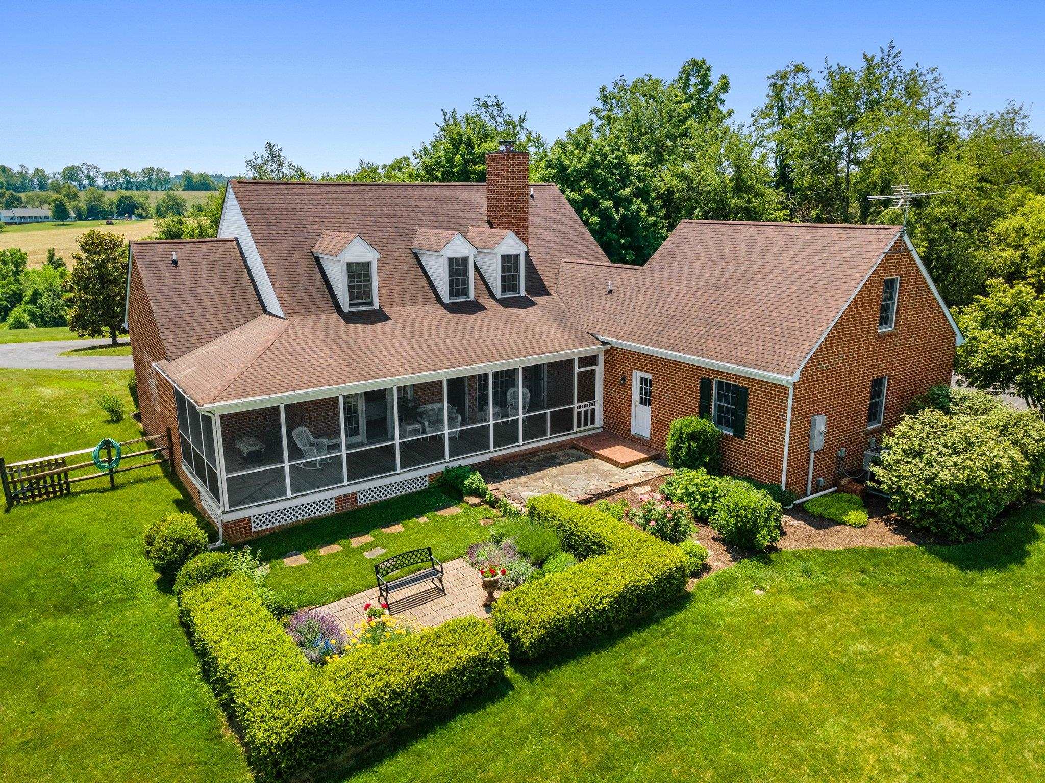 1217 Middlebrook Road Staunton, VA 24401 - Photo 12 of 46 a aerial view of a house with a yard table and chairs
