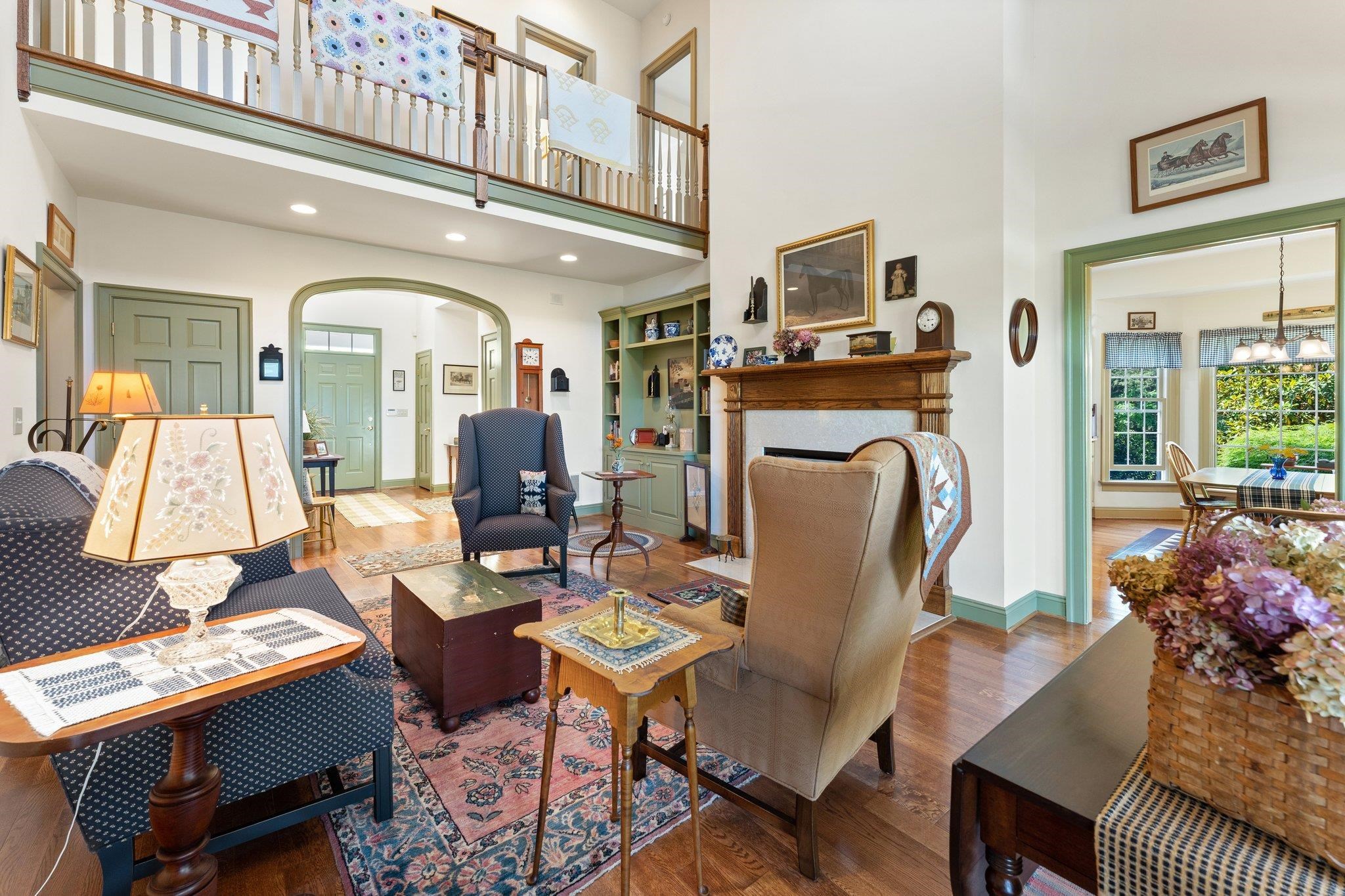 1217 Middlebrook Road Staunton, VA 24401 - Photo 23 of 46 a living room with furniture a fireplace and a chandelier