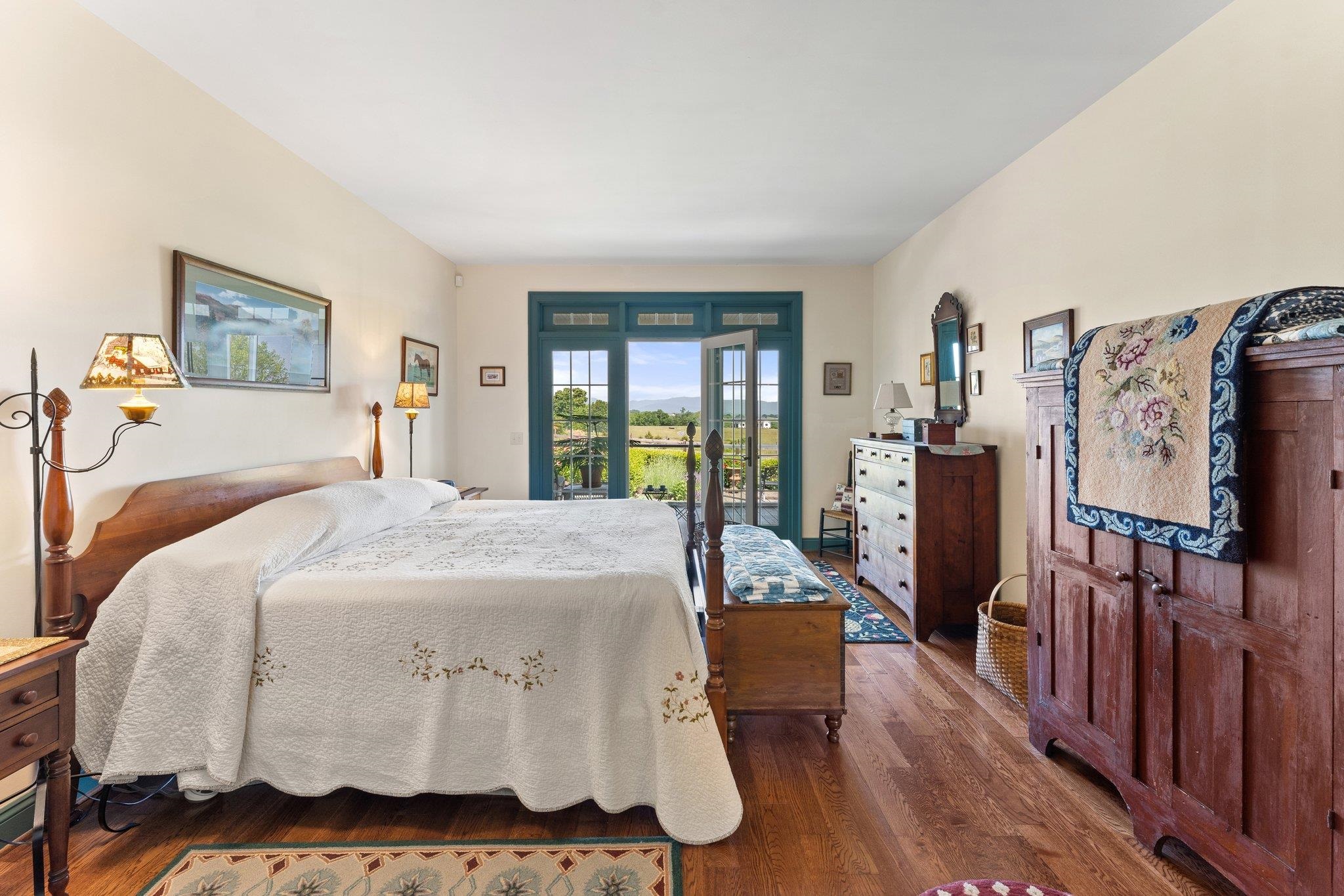 1217 Middlebrook Road Staunton, VA 24401 - Photo 26 of 46 a bedroom with a bed and wooden floor