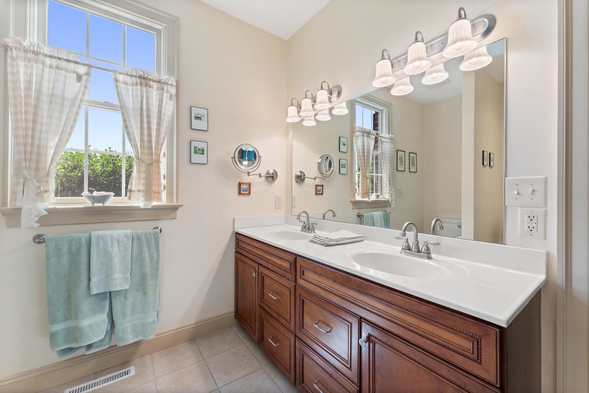 1217 Middlebrook Road Staunton, VA 24401 - Photo 29 of 46 a bathroom with a sink a mirror and a shower