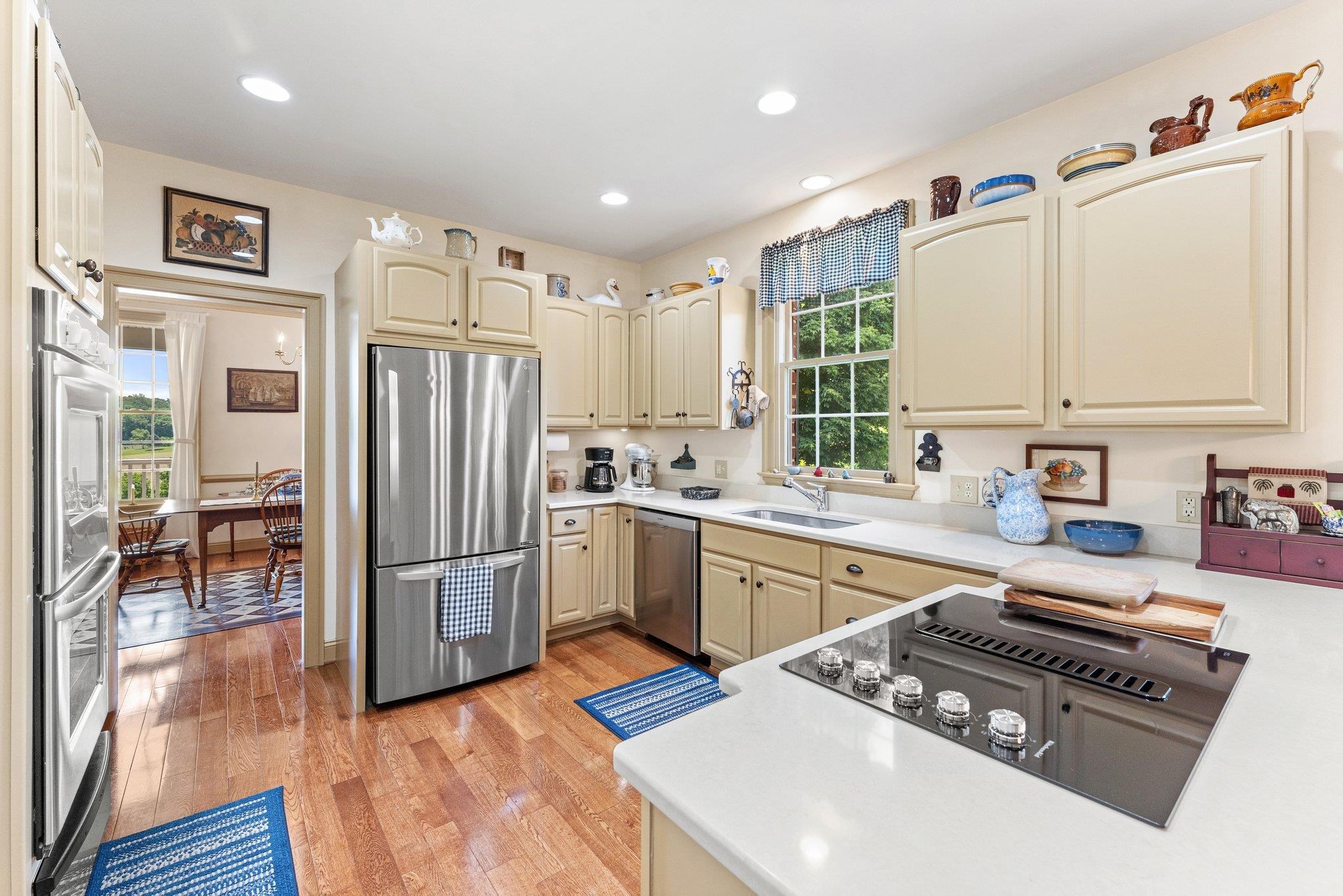 1217 Middlebrook Road Staunton, VA 24401 - Photo 32 of 46 a kitchen with stainless steel appliances granite countertop a refrigerator stove and sink