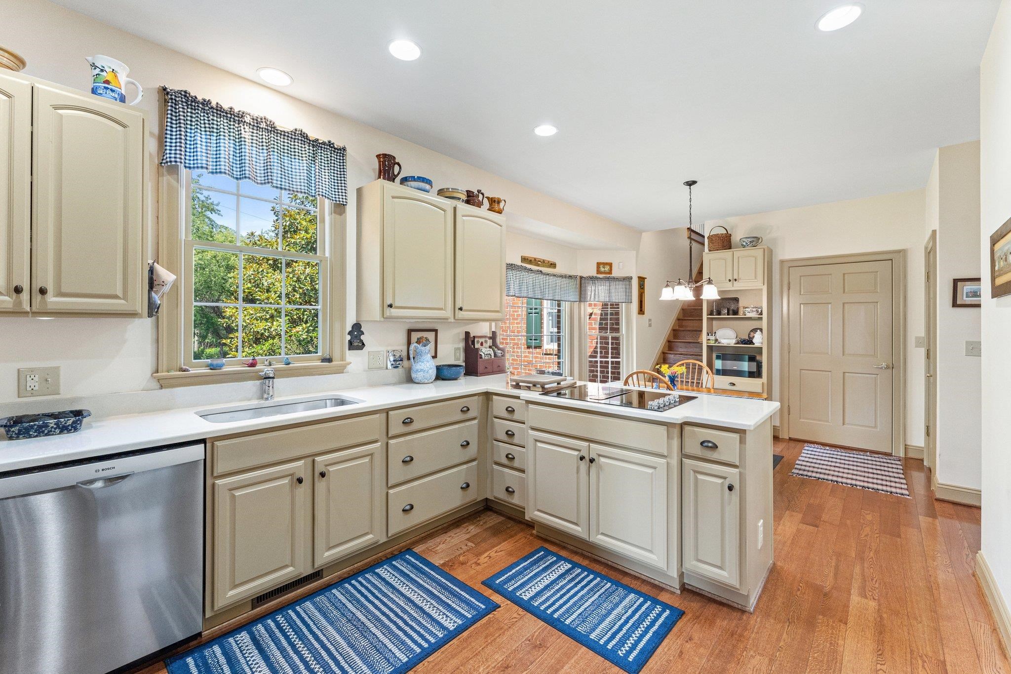 1217 Middlebrook Road Staunton, VA 24401 - Photo 34 of 46 a kitchen with stainless steel appliances a sink cabinets and wooden floor