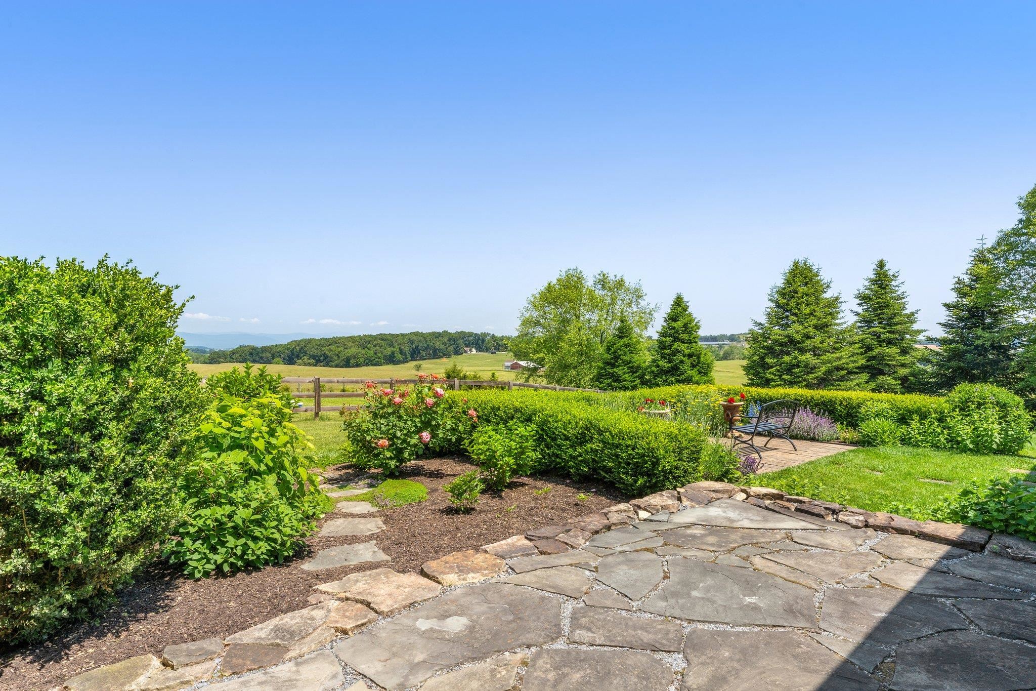 1217 Middlebrook Road Staunton, VA 24401 - Photo 42 of 46 a view of a garden with a building in the background