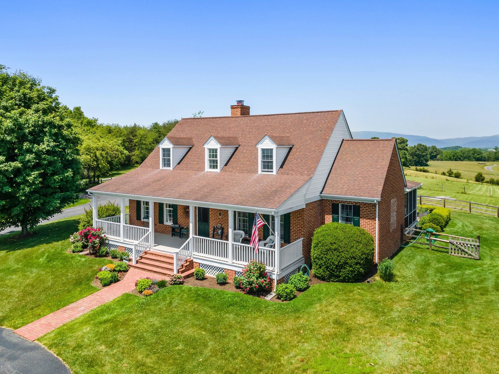 1217 Middlebrook Road Staunton, VA 24401 - Photo 6 of 46 a front view of a house with a yard table and chairs