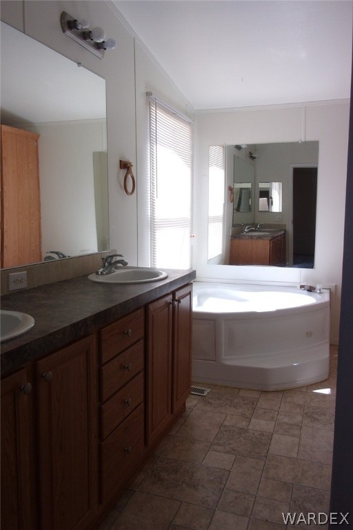 3313 Houck Road Golden Valley, AZ 86413 - Photo 19 of 33 a bathroom with a sink vanity and mirror