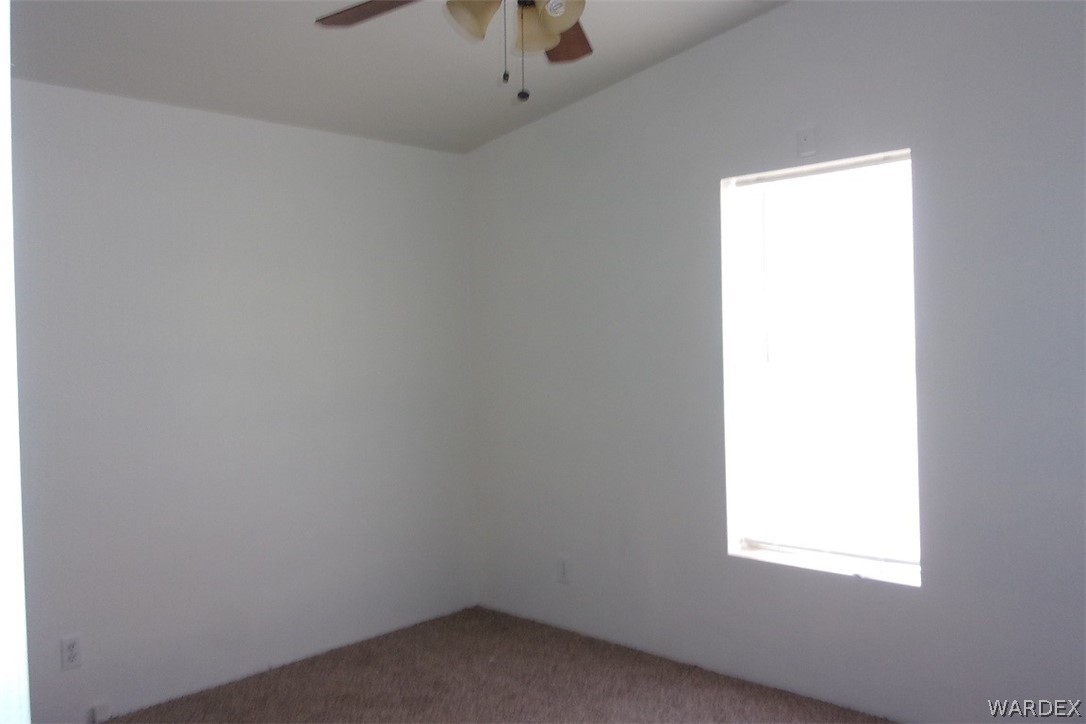 3313 Houck Road Golden Valley, AZ 86413 - Photo 28 of 33 an empty room with a window