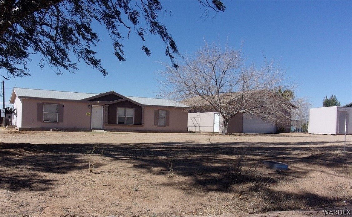 3313 Houck Road Golden Valley, AZ 86413 - Photo 3 of 33 a view of a house with a yard