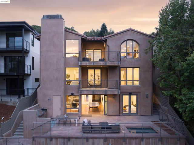 a front view of a residential apartment building with a yard