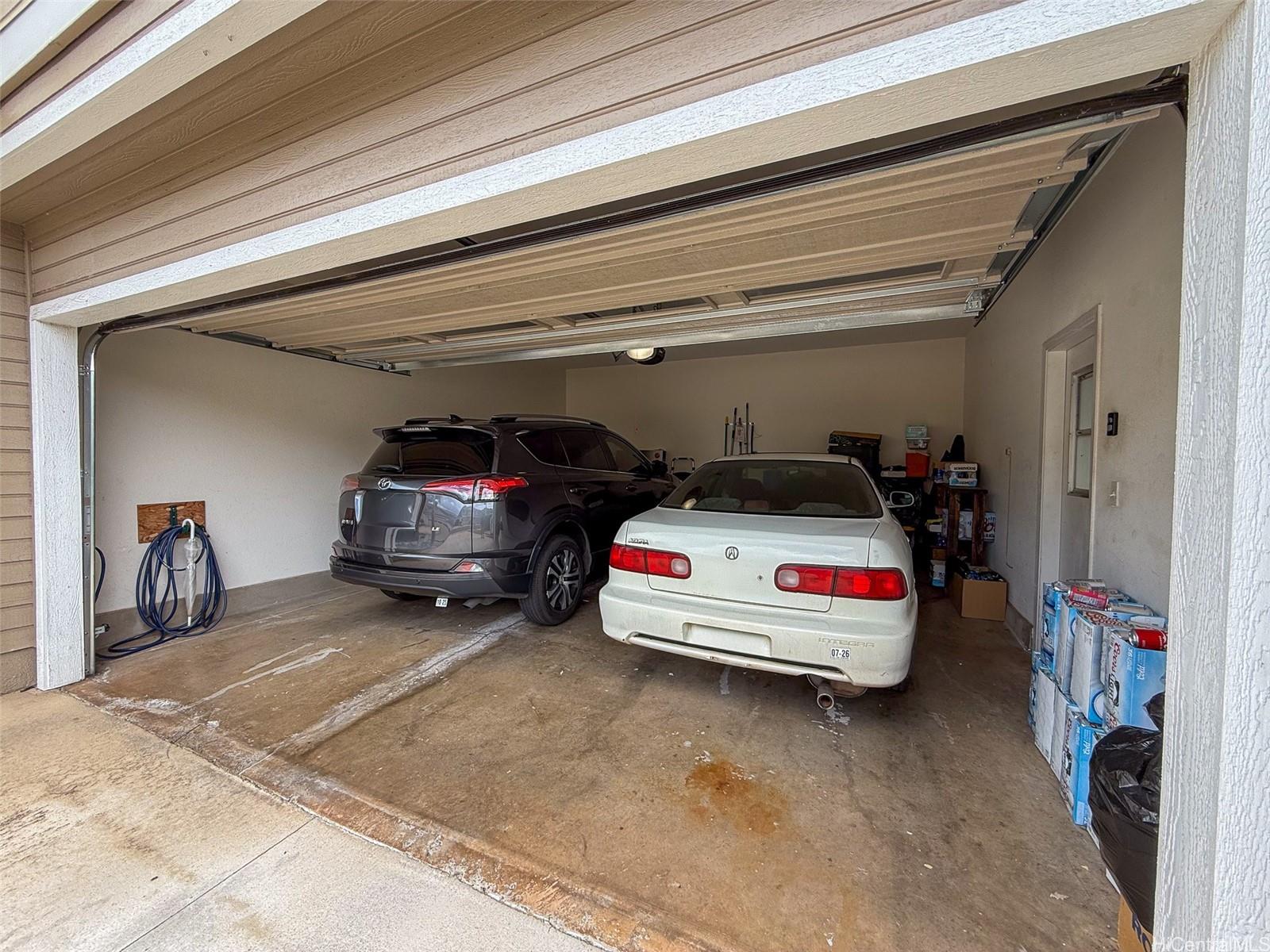 92-1519 Ali'inui Drive, Unit 12A Kapolei, HI 96707 - Photo 12 of 25 a car parked in garage