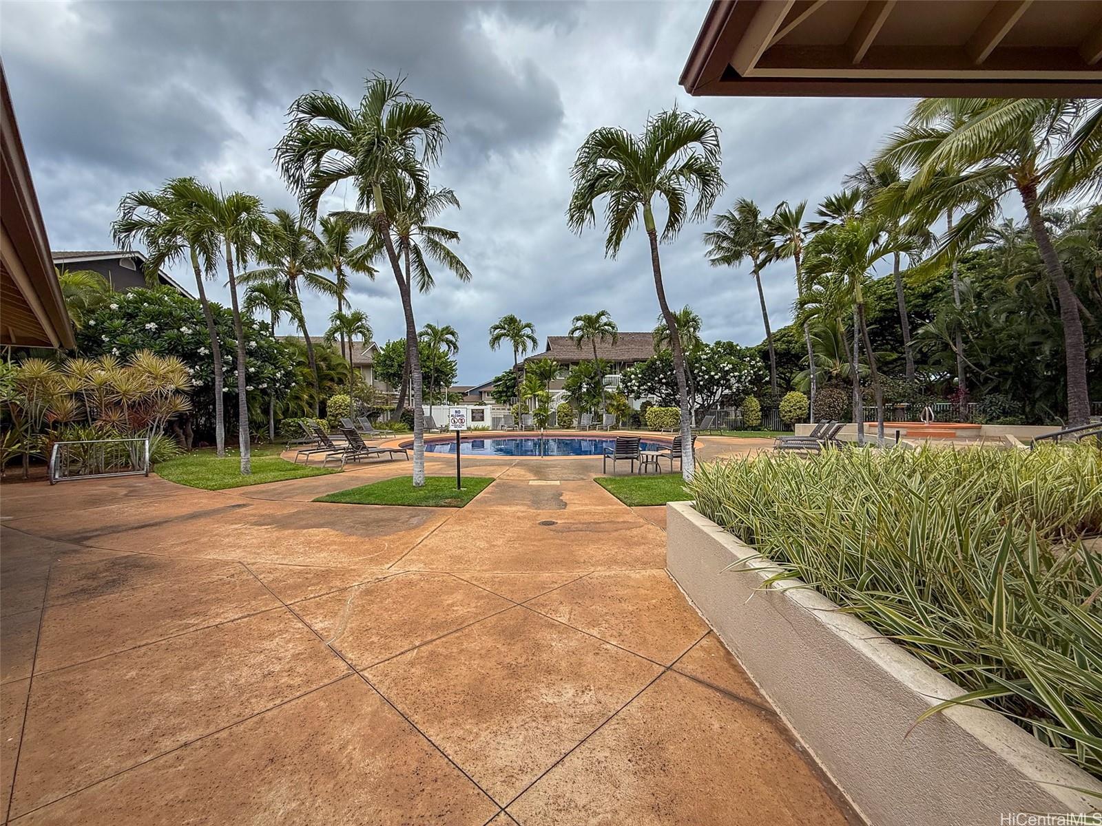 92-1519 Ali'inui Drive, Unit 12A Kapolei, HI 96707 - Photo 16 of 25 a view of outdoor space with swimming pool